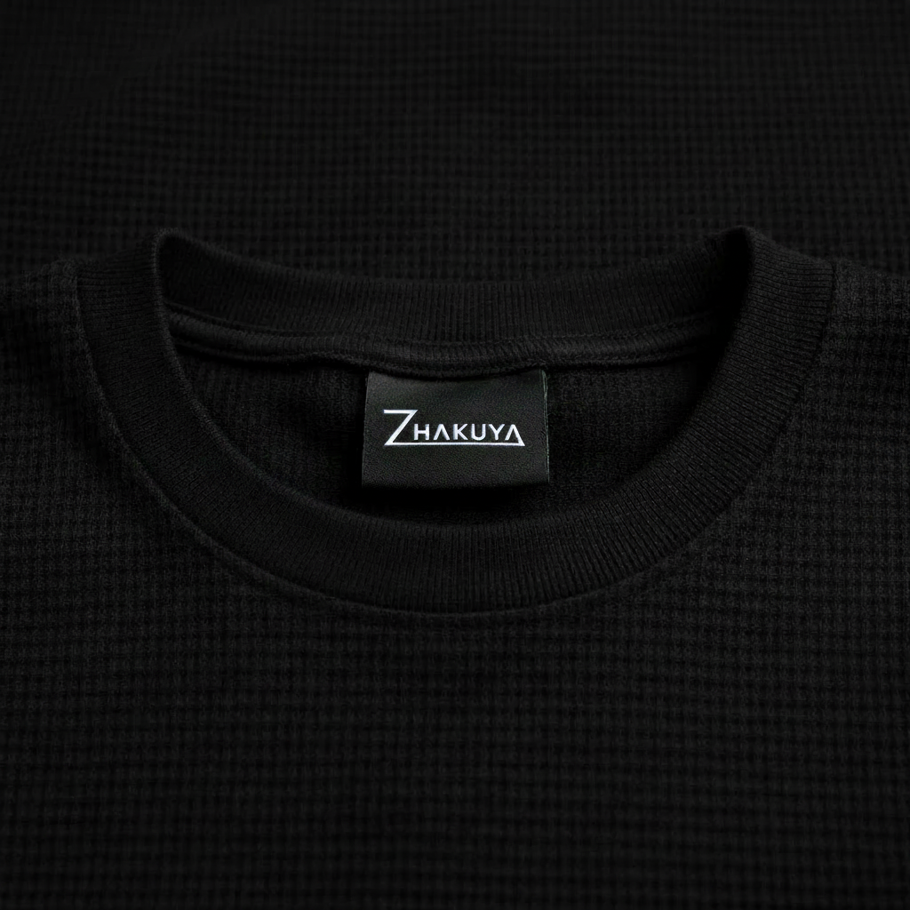 Black waffle collar close-up with Zhakuya neck label