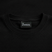 Black waffle collar close-up with Zhakuya neck label